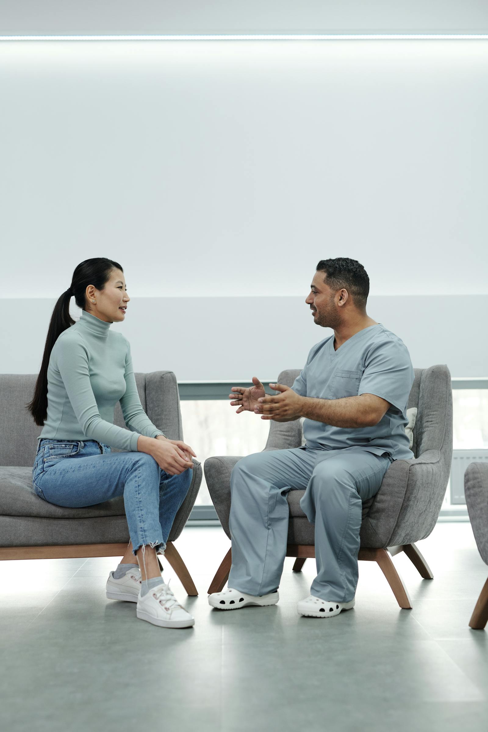 Clinician discussing bariatric surgery records, follow-up, and travel risk with a patient