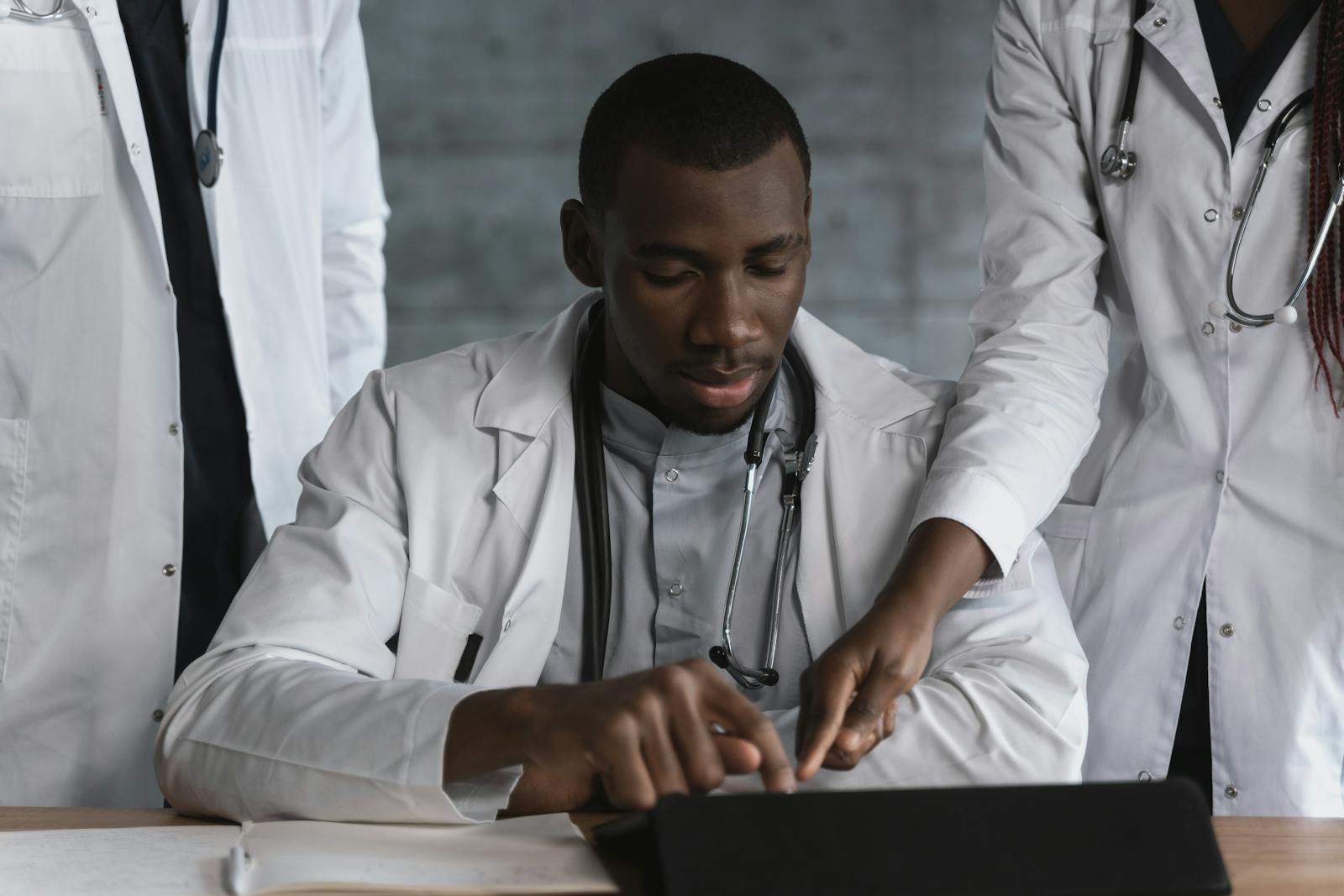 Investigators comparing source records before publishing a surgeon profile